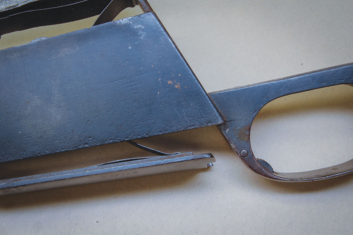 A sporter-type button floorplate release on a Siamese action.